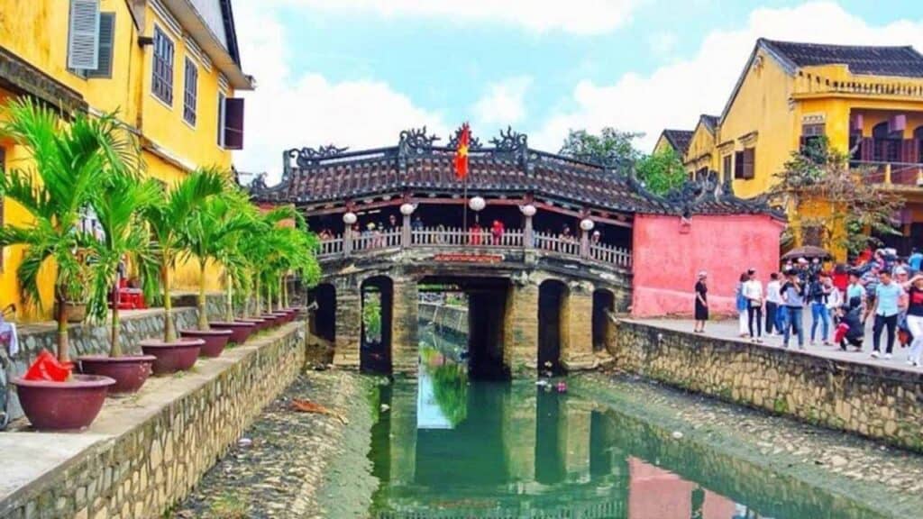 Historic Vietnamese bridge with lanterns in Hoi An, Vietnam.