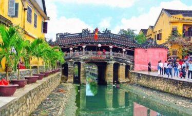 Historic Vietnamese bridge with lanterns in Hoi An, Vietnam.