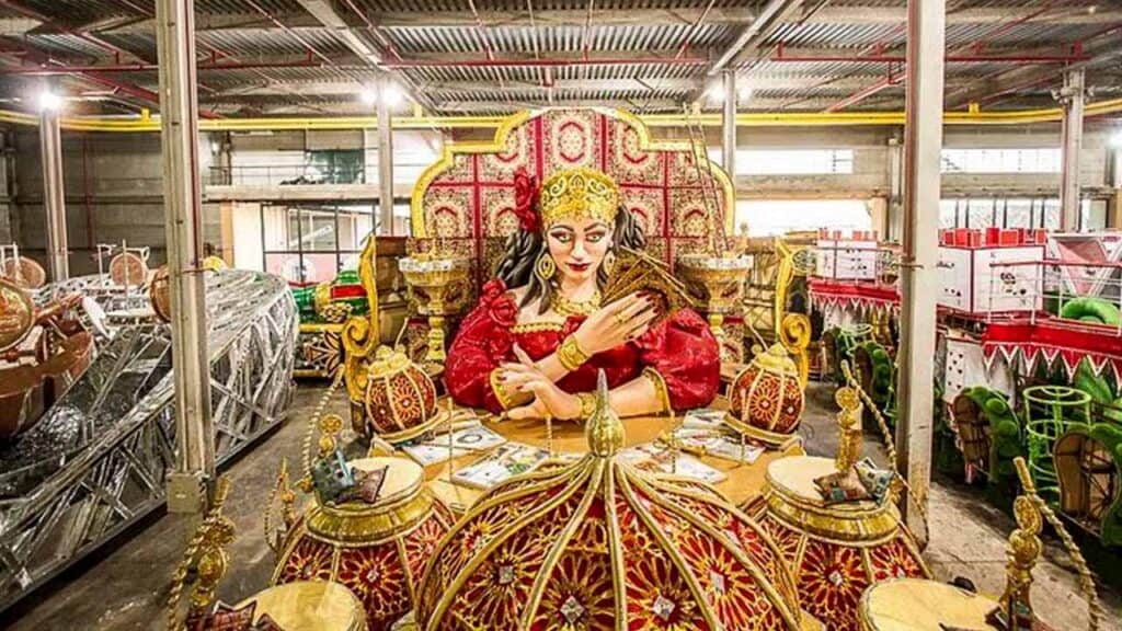 Colourful Indian deity statue with intricate details and vibrant colours.