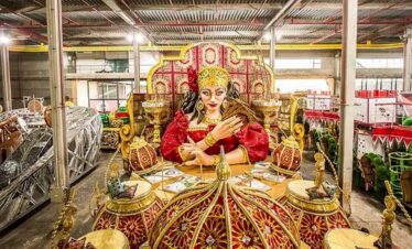 Colourful Indian deity statue with intricate details and vibrant colours.