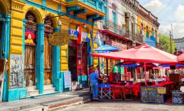 Brightly coloured buildings and lively street scene in Buenos Aires.