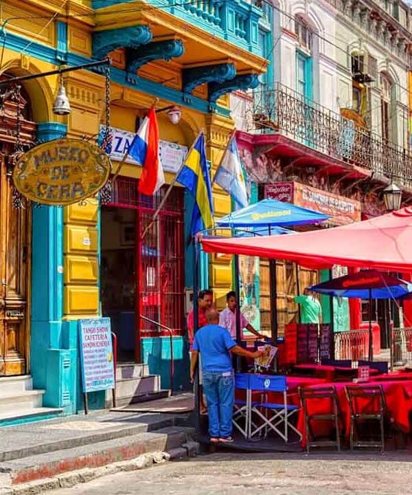 Brightly coloured buildings and lively street scene in Buenos Aires.
