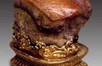 Ancient Chinese bronze and gold artifact on display.