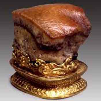 Ancient Chinese bronze and gold artifact on display.