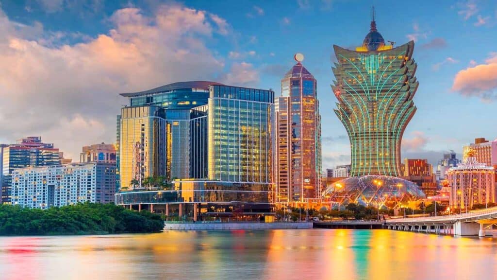 Modern Hong Kong skyline with iconic skyscrapers and Victoria Harbour view at sunset.