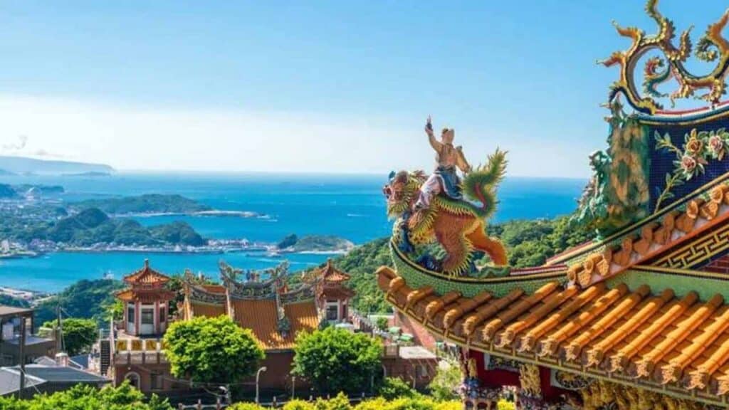 Asian temple with dragon sculpture overlooking scenic coastal landscape.