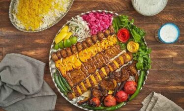 Vibrant Indian Thali featuring diverse dishes, vegetables, and spices for a cultural culinary experi.