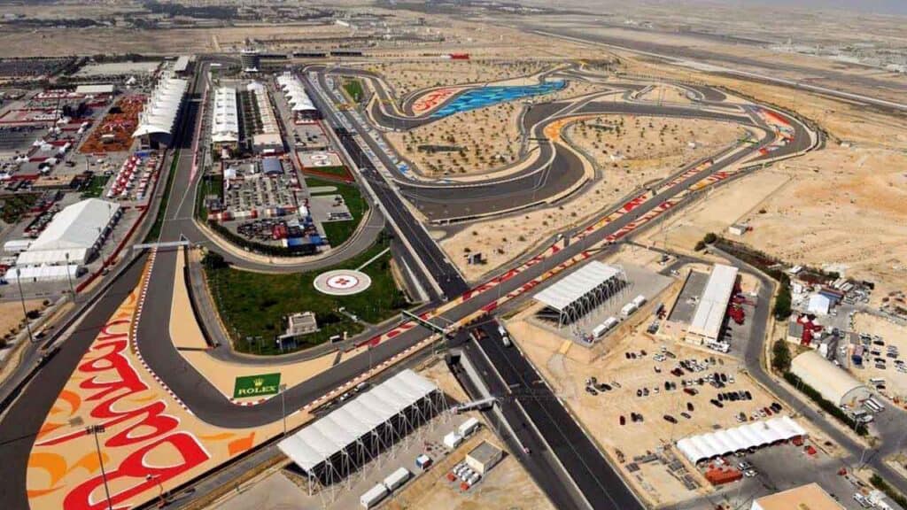 Race track at a desert racing circuit with sharp turns and spectator areas.