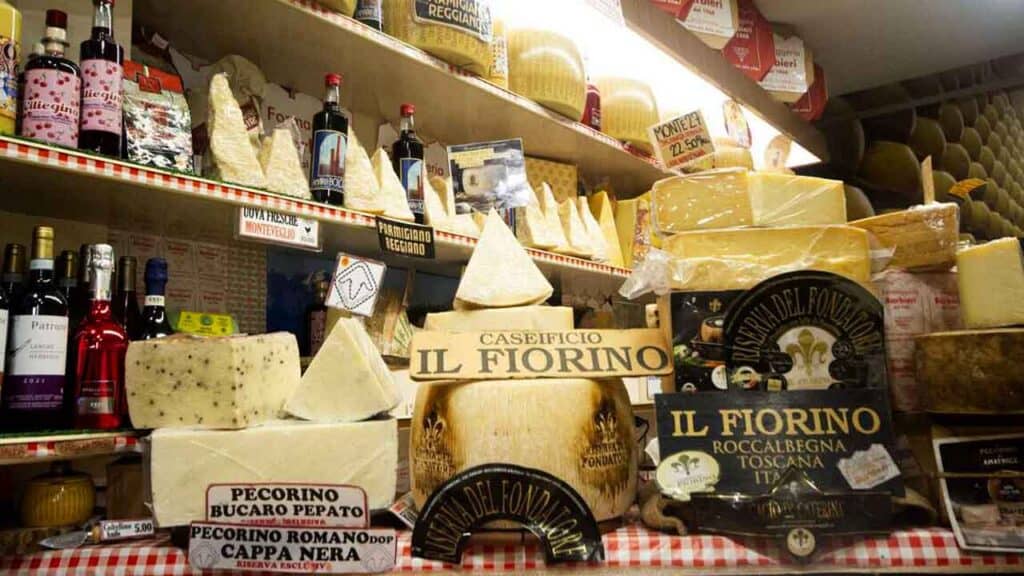 Assorted Italian cheeses including Pecorino and Parmesan on display.