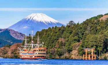 Mount Fuji and Lake Ashi with a cruise ship, Japan.
