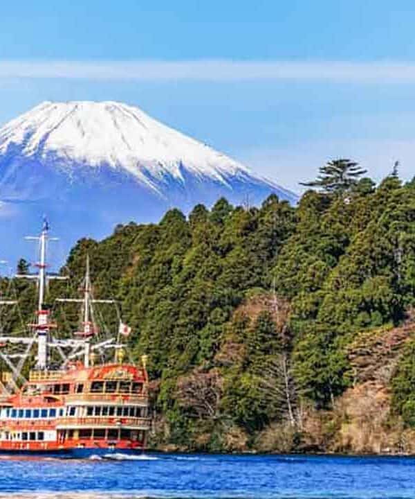 Mount Fuji and Lake Ashi with a cruise ship, Japan.