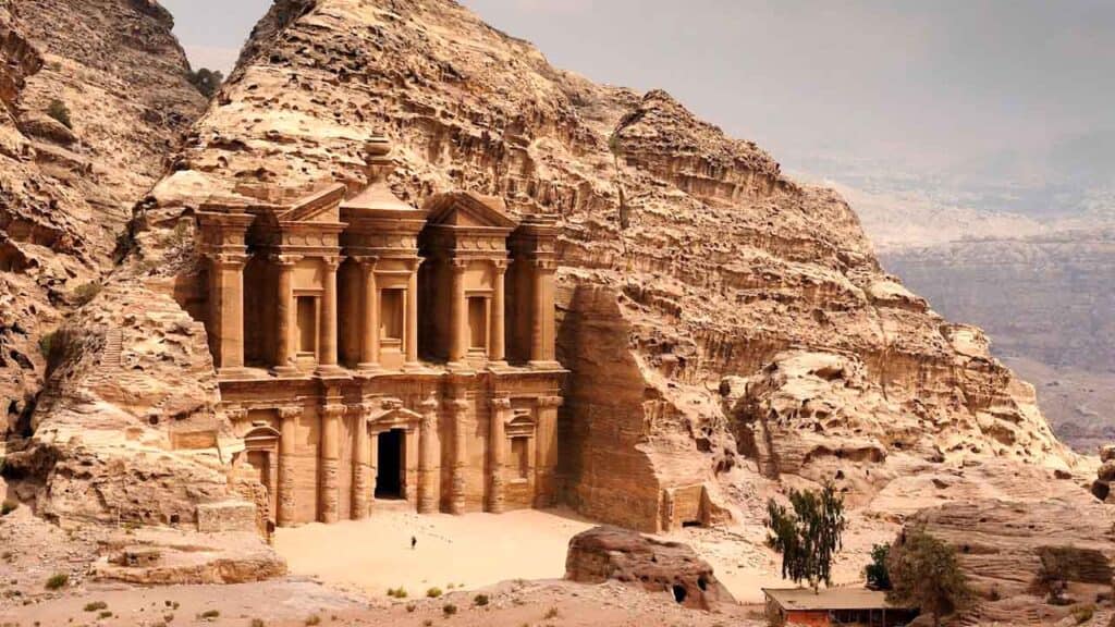Ancient Petra Treasury carved into sandstone cliffs in Jordan, showcasing remarkable archaeological.