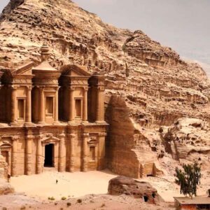 Ancient Petra Treasury carved into sandstone cliffs in Jordan, showcasing remarkable archaeological.