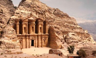Ancient Petra Treasury carved into sandstone cliffs in Jordan, showcasing remarkable archaeological.