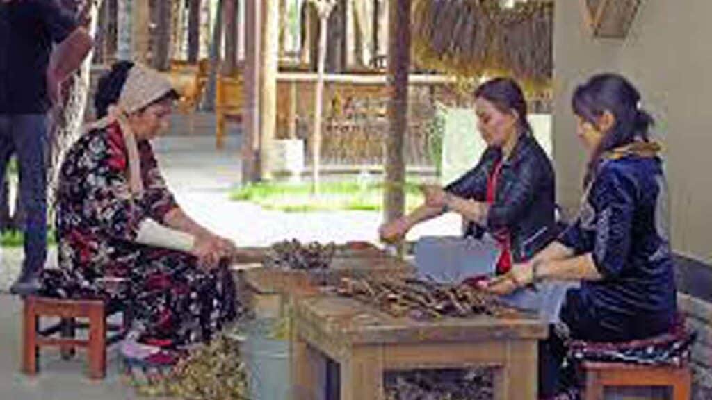 Traditional craft workshop with local artisans in a rural setting.