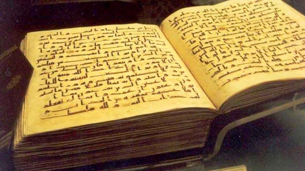 Open ancient Hebrew manuscript with handwritten text in black ink.