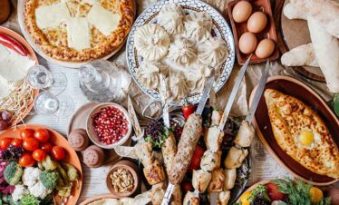 Authentic Georgian Khachapuri with cheese, eggs, and fresh ingredients.
