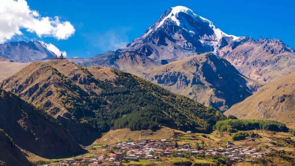 Snow-capped Mount Cook with Aoraki Village in the foreground, New Zealand.