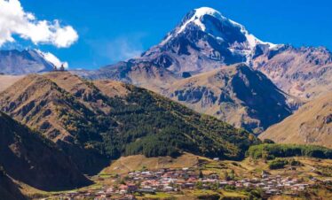 Snow-capped Mount Cook with Aoraki Village in the foreground, New Zealand.