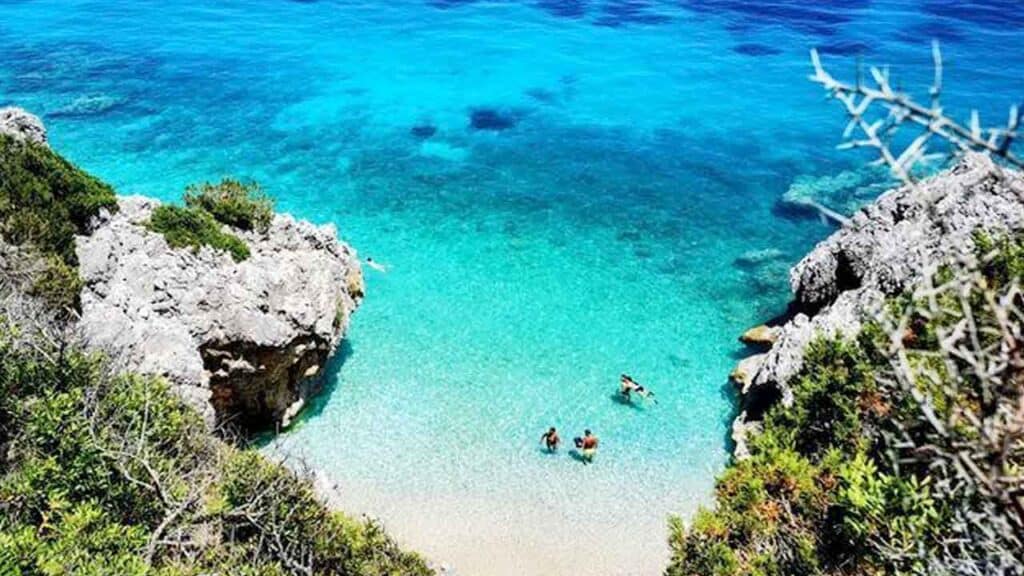 Beautiful tropical beach with turquoise waters and rocky cliffs. Perfect for relaxing holidays and w.