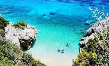 Beautiful tropical beach with turquoise waters and rocky cliffs. Perfect for relaxing holidays and w.