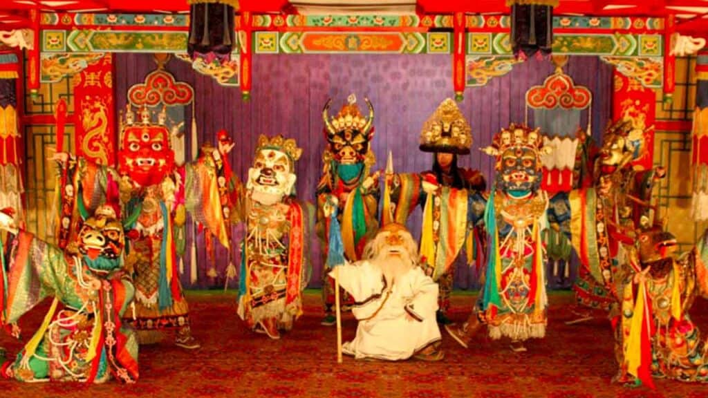 Traditional Asian puppet show with colourful costumes and masks.