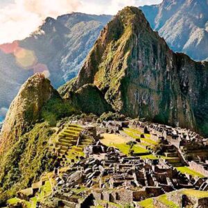 Ancient Incan city of Machu Picchu nestled high in the Andes, surrounded by lush green mountains and.