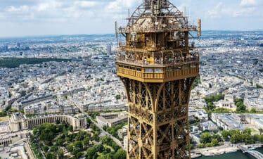 Aerial view of the Eiffel Tower in Paris with cityscape background.